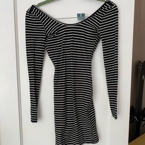 Adorable mini, form fitting stripped dress.